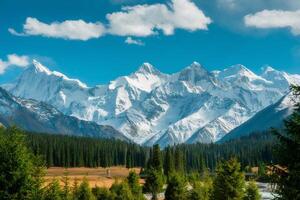 Majestic Snowcapped Mountain Range under a Bright Blue Sky photo