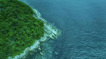 Aerial View of Lush Green Island and Turquoise Ocean photo