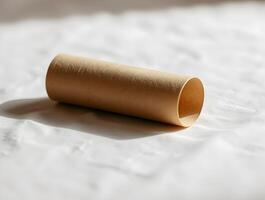 A rolled up piece of paper sitting on a white surface photo