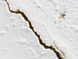 White Texture Cracked Surface Abstract Background Detailed Macro Photography of a Fissured Material photo
