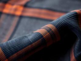 Textured Plaid Fabric CloseUp of Deep Blue and Burnt Orange Woven Textile photo