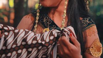 A Javanese Woman Wipes Away a Man's Tears with a Batik Handkerchief video