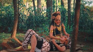Wide Shot of Javanese Couple in a Tender Embrace in a Forest video