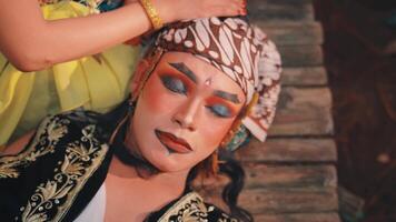 Top-Down View of a Javanese Performer Resting video