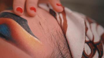 Extreme Close-Up of a Woman's Hand Stroking a Man's Forehead video
