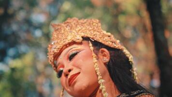 Close-up Portrait of a Serene Javanese Dancer with Golden Headdress video
