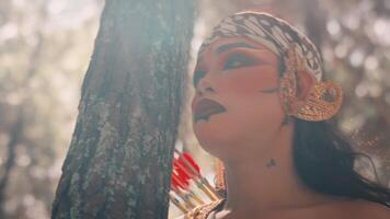 Close-up of Javanese Archer in a Sun-Dappled Forest video