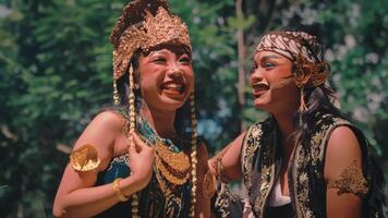 Playful and Expressive Javanese Dancers Interacting in a Forest video