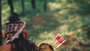 Following a Javanese Archer Through a Forest Clearing video