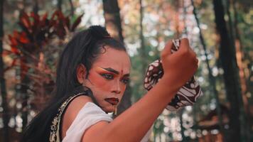 A Sad Javanese Man Wringing a Batik Handkerchief video