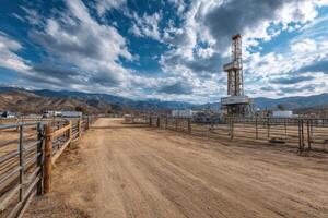 A drilling rig in the middle of a dirt road photo