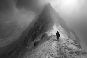 A man standing on the top of a mountain photo