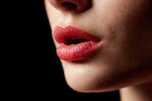 A close up of a woman's lips with red lipstick photo
