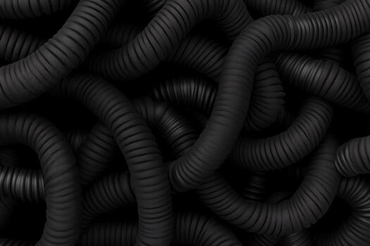 Abstract black textured coils intertwining in a complex pattern forming a visually striking surface photo