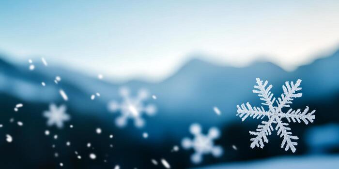 Snowflakes gently falling in a serene winter landscape at dusk with blurred mountain background photo