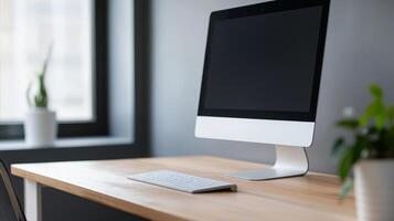Modern workspace with a sleek desktop computer showcasing simplicity and elegance in a well-lit office environment photo