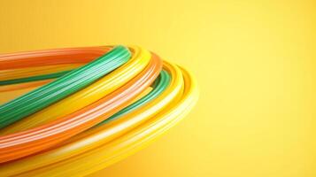 Colorful plastic tubing coils on a vibrant yellow background showcasing versatility for various applications in design and crafts photo