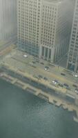Aerial view Chicago downtown, car traffic and city life from a bird's eye view. The movement of suburban subway trains and people during rush hour. Cloudy day video
