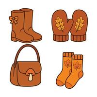 Autumn fashion accessories including boots and mittens vector