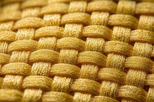 Close up view of woven Kevlar fabric showcasing its intricate texture and durability characteristics during manufacturing photo