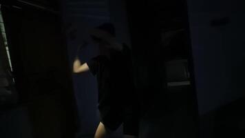 Mysterious Figure in Dim Hallway with Flashlight video