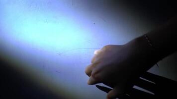 Illuminated Hand Reaching Towards Wall video
