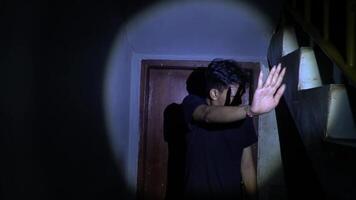 Suspenseful Figure in Dimly Lit Hallway video