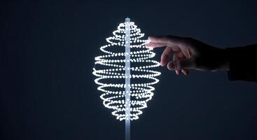 A person holding a lighted spiral object photo