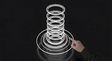 A person pointing at a ring of rings photo