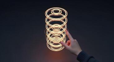A person holding up a lighted spiral photo