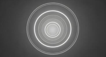 A circular light is shown in the middle of a dark background photo