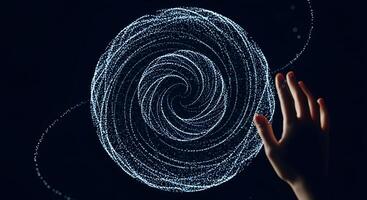 A person's hand is touching a circular object photo