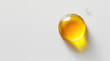A drop of oil on a white surface photo