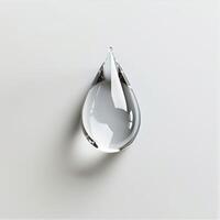 A drop of water on a white surface photo
