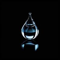 A drop of water on a black surface photo