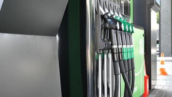 Angle View Of Petrol Column With Nozzles For Different Fuels photo