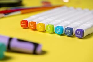 Vibrant alcohol art markers displaying a spectrum of colors like Watermelon Red, Orange, and Cerulean Blue, ideal for artistic design and creative use photo