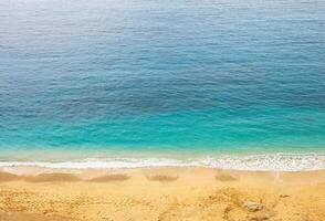 Top view of beautiful blue sea water with sand beach. photo