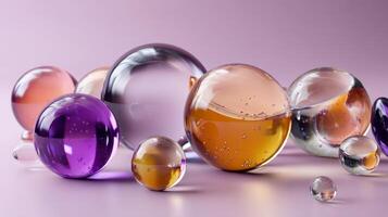 Multiple colorful transparent spheres of varying sizes are creating an abstract composition on a purple background, with some spheres containing liquid and small bubbles photo