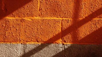 Rough orange and gray wall with diagonal shadows. Abstract textured background. photo