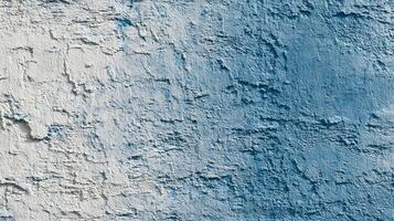 Close-up of blue and white textured wall. Rough stucco surface backdrop. photo