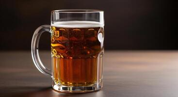 Refreshing amber beer in a classic glass mug, with foam, on a dark wooden table. photo