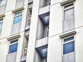 Apartment Building Exterior Featuring Windows and Architectural Details photo