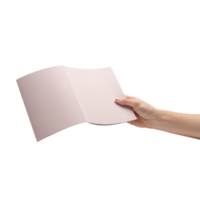 A hand holds open a folded piece of paper possibly a document or brochure for png