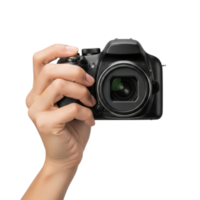 A persons hand firmly grips a black digital dslr camera ready to capture a png