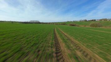 Fast FPV drone flying over lush farmland and aqueduct in UK rural area video