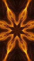 Yellow and black star shaped object with black background. Kaleidoscope VJ loop Vertical video