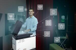 Young man using a multifunction printer to scan documents while discussing digital connectivity features in a modern workspace photo