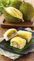 Delicious Durian Dessert and Whole Fruit Displayed Artistically. photo