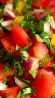 Fresh Pico de Gallo Close Up with Vibrant Red Tomatoes and Green Herbs. photo
